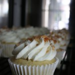Vanilla Bean Cupcake filled with old fashion Coconut Custard and topped with toasted Coconut